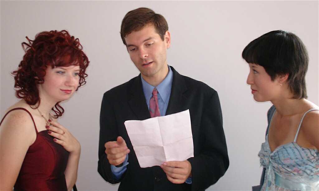 Three last minute people studying the lines